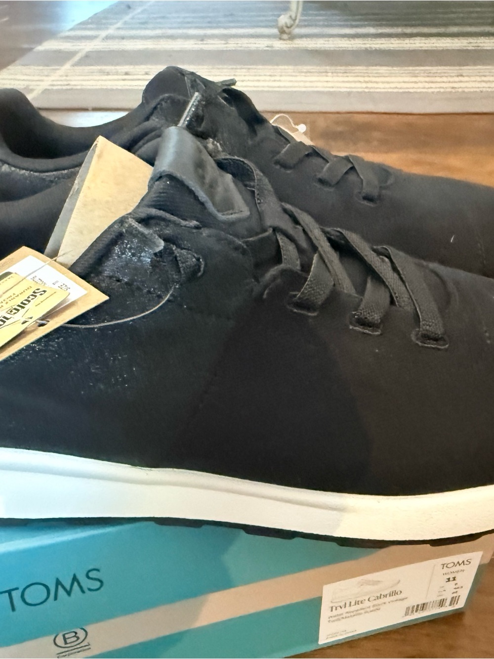 TOMS woman’s black vintage water, repellent, sneakers